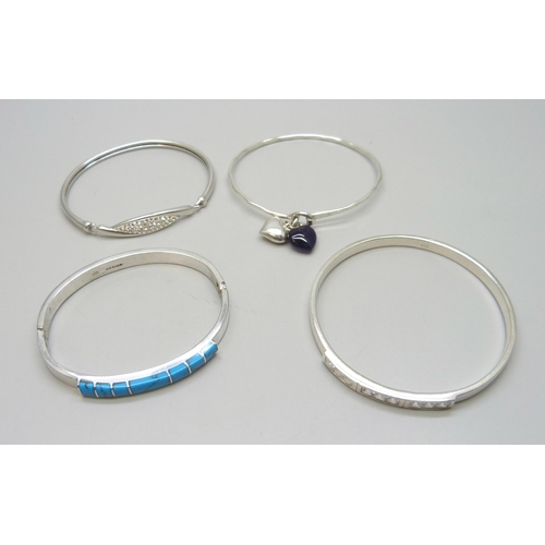 7056 - Four silver stone set bangles including Mexican, 72g total