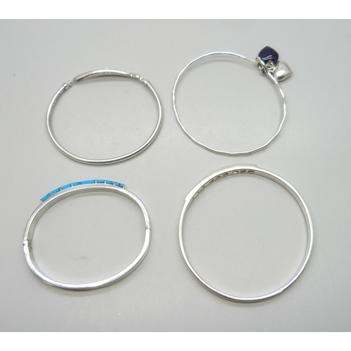 7056 - Four silver stone set bangles including Mexican, 72g total