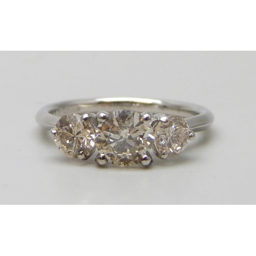 7117 - A platinum set three stone diamond ring, total diamond weight 1.50ct, (centre diamond 0.78cts), 4.2g...