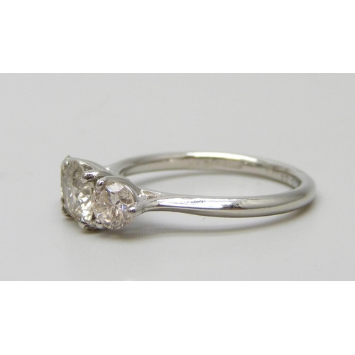 7117 - A platinum set three stone diamond ring, total diamond weight 1.50ct, (centre diamond 0.78cts), 4.2g... 