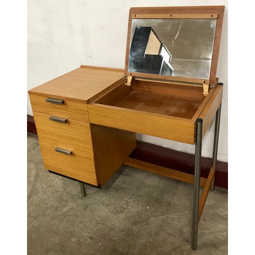 34 - A Stag Fineline teak and chrome dressing table, designed by John & Sylvia Reed