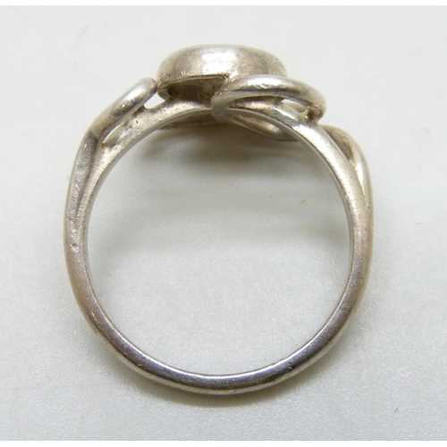 7185 - A white metal Arts & Crafts style ring set with a triplet opal, tests as silver, O