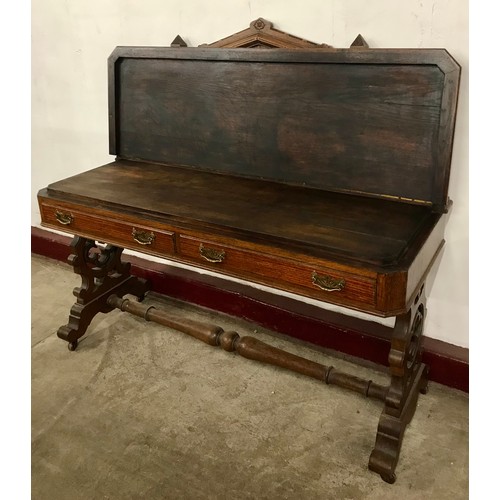 58 - A Victorian Gothic Revival carved oak serving table
