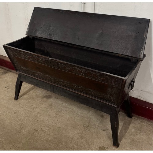 65 - A 19th Century Jacobean Revival carved oak dough bin