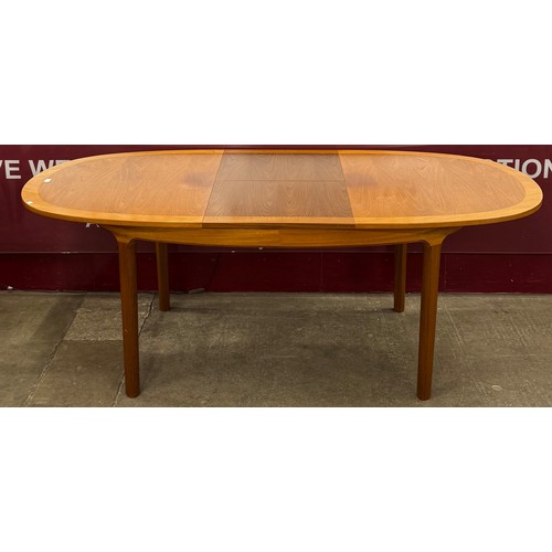 2 - A Nathan teak oval extending dining table and six chairs
