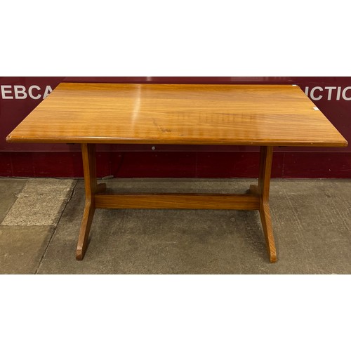 38 - A teak rectangular dining table and four chairs