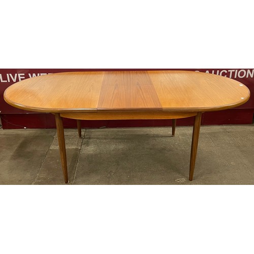 38C - A G-Plan Fresco teak oval extending dining table and four chairs