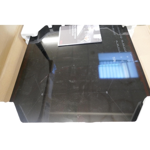 4291 - An AEG venting induction 4 zone hob with Senseboil, and a AEG hob (607-110,221)(Both damaged) *This ... 
