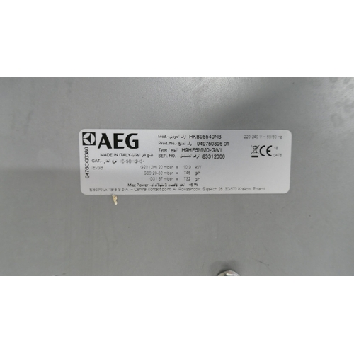 4253 - An AEG induction 4 zone hob with Senseboil, an AEG 5 ring cooker hob (missing parts both damaged) (6... 