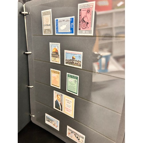 2103 - Stamps; Turkish Cypriot Post stamps, unmounted mint collection displayed on hanger sheets in a binde... 