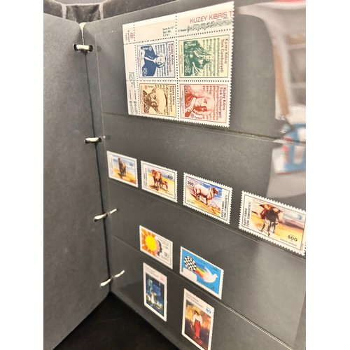 2103 - Stamps; Turkish Cypriot Post stamps, unmounted mint collection displayed on hanger sheets in a binde... 