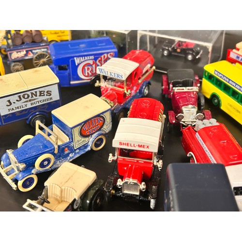 2104 - A collection of over twenty die-cast model cars, Lledo, Days Gone, etc.