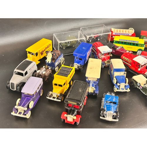 2104 - A collection of over twenty die-cast model cars, Lledo, Days Gone, etc.