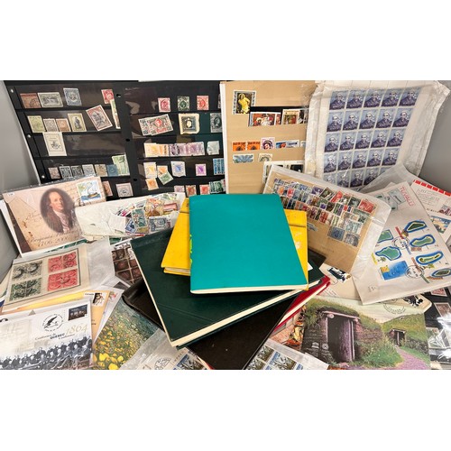 2111 - A box of stamp albums, covers, etc.