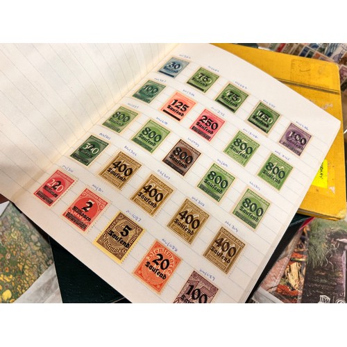 2111 - A box of stamp albums, covers, etc.