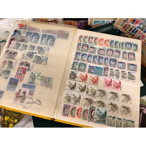 2111 - A box of stamp albums, covers, etc.