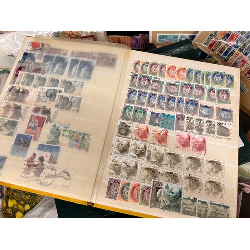 2111 - A box of stamp albums, covers, etc.