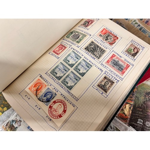 2111 - A box of stamp albums, covers, etc.