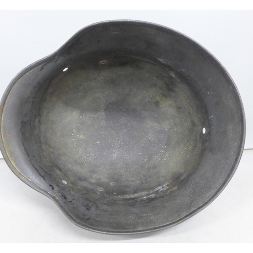 2038 - A German World War II helmet shell, M35, with later added post war decal detail