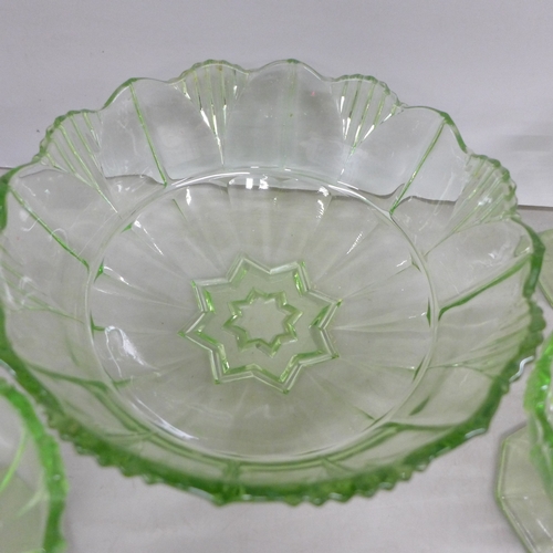2058 - Five uranium glass bowls, one bowl and four dishes