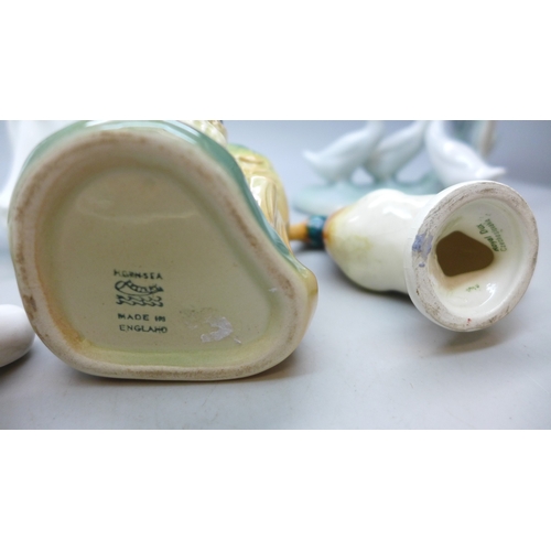 2062 - A collection of china to include two Royal Doulton figures, Nao ducks, Royal Dux mallard duck figure... 