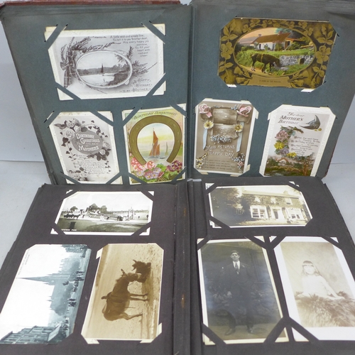 2069 - Two postcard albums with over 200 early to mid 20th postcards