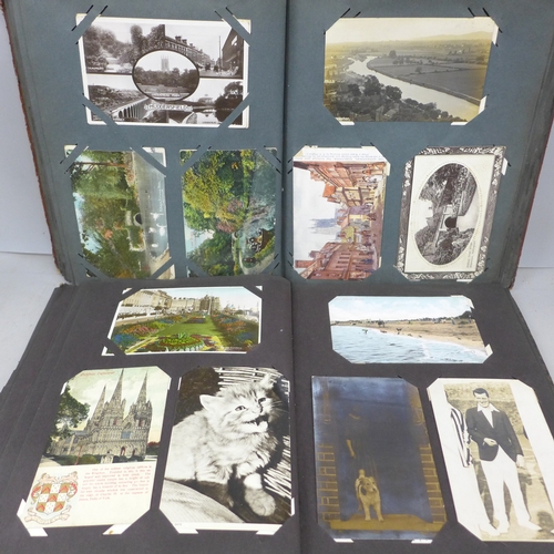 2069 - Two postcard albums with over 200 early to mid 20th postcards