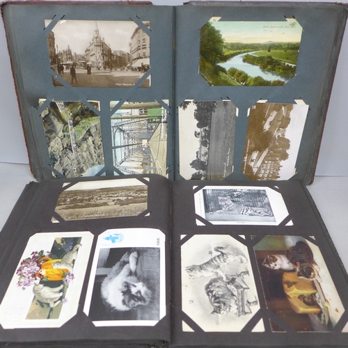 2069 - Two postcard albums with over 200 early to mid 20th postcards