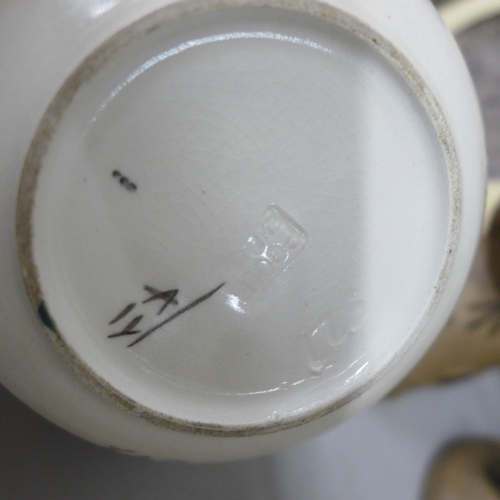 2071 - A collection of Poole pottery including two bird figures and a lidded pot