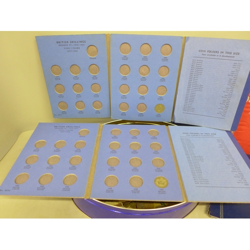 2072 - Coins; ten coin folders, some with coins, a large collection of loose coins including pennies, bank ... 