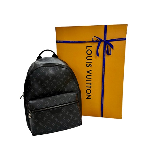 7100 - A Louis Vuitton Discovery backpack, grey/black monogram, approximately 35cm tall, with paperwork (gi... 