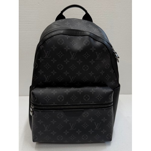 7100 - A Louis Vuitton Discovery backpack, grey/black monogram, approximately 35cm tall, with paperwork (gi... 
