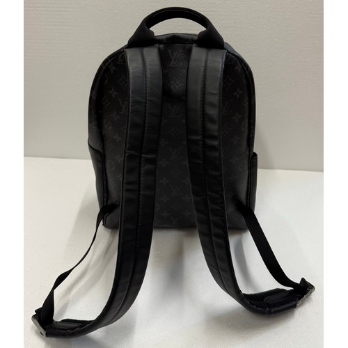 7100 - A Louis Vuitton Discovery backpack, grey/black monogram, approximately 35cm tall, with paperwork (gi... 