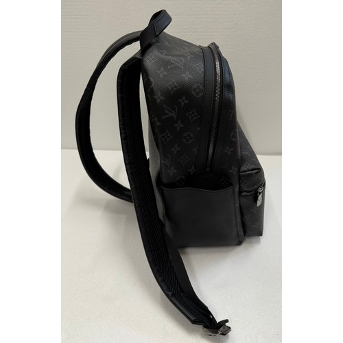 7100 - A Louis Vuitton Discovery backpack, grey/black monogram, approximately 35cm tall, with paperwork (gi... 