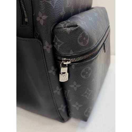 7100 - A Louis Vuitton Discovery backpack, grey/black monogram, approximately 35cm tall, with paperwork (gi... 