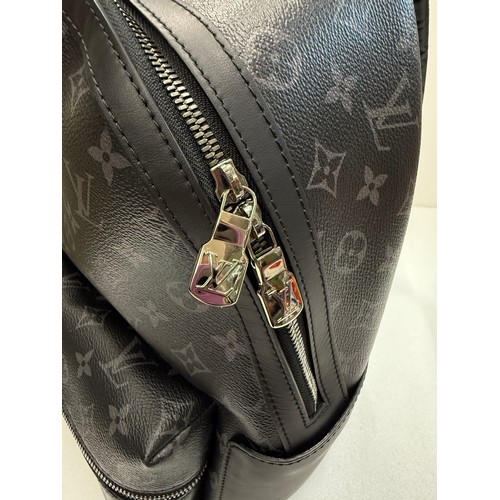 7100 - A Louis Vuitton Discovery backpack, grey/black monogram, approximately 35cm tall, with paperwork (gi... 