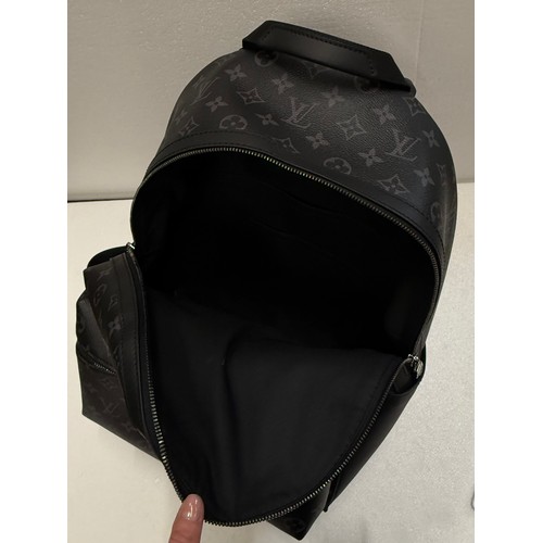 7100 - A Louis Vuitton Discovery backpack, grey/black monogram, approximately 35cm tall, with paperwork (gi... 