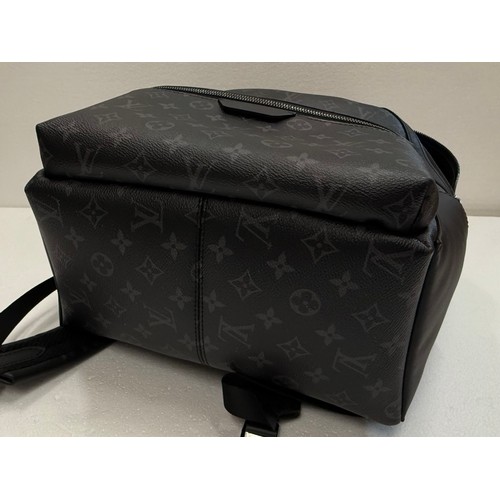 7100 - A Louis Vuitton Discovery backpack, grey/black monogram, approximately 35cm tall, with paperwork (gi... 