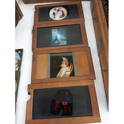 2199 - A large 19th Century wooden and brass magic lantern with three boxes of slides including humour, map... 