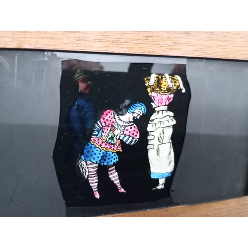 2199 - A large 19th Century wooden and brass magic lantern with three boxes of slides including humour, map... 