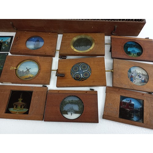 2199 - A large 19th Century wooden and brass magic lantern with three boxes of slides including humour, map... 