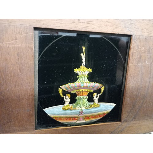 2199 - A large 19th Century wooden and brass magic lantern with three boxes of slides including humour, map... 