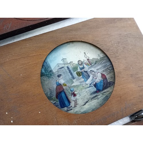 2199 - A large 19th Century wooden and brass magic lantern with three boxes of slides including humour, map... 