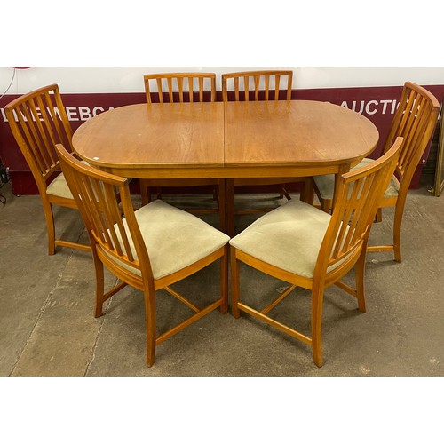 57 - A McIntosh teak oval extending dining table and six chairs