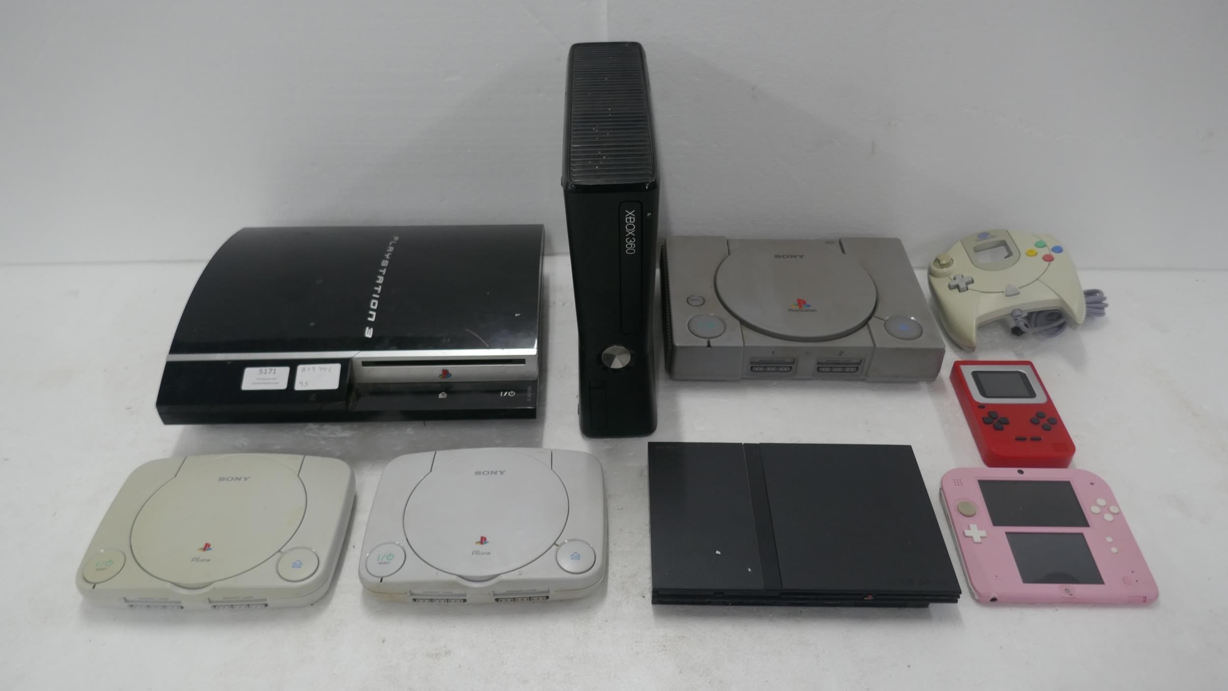 A large quantity of games consoles for spares or repairs including a ...