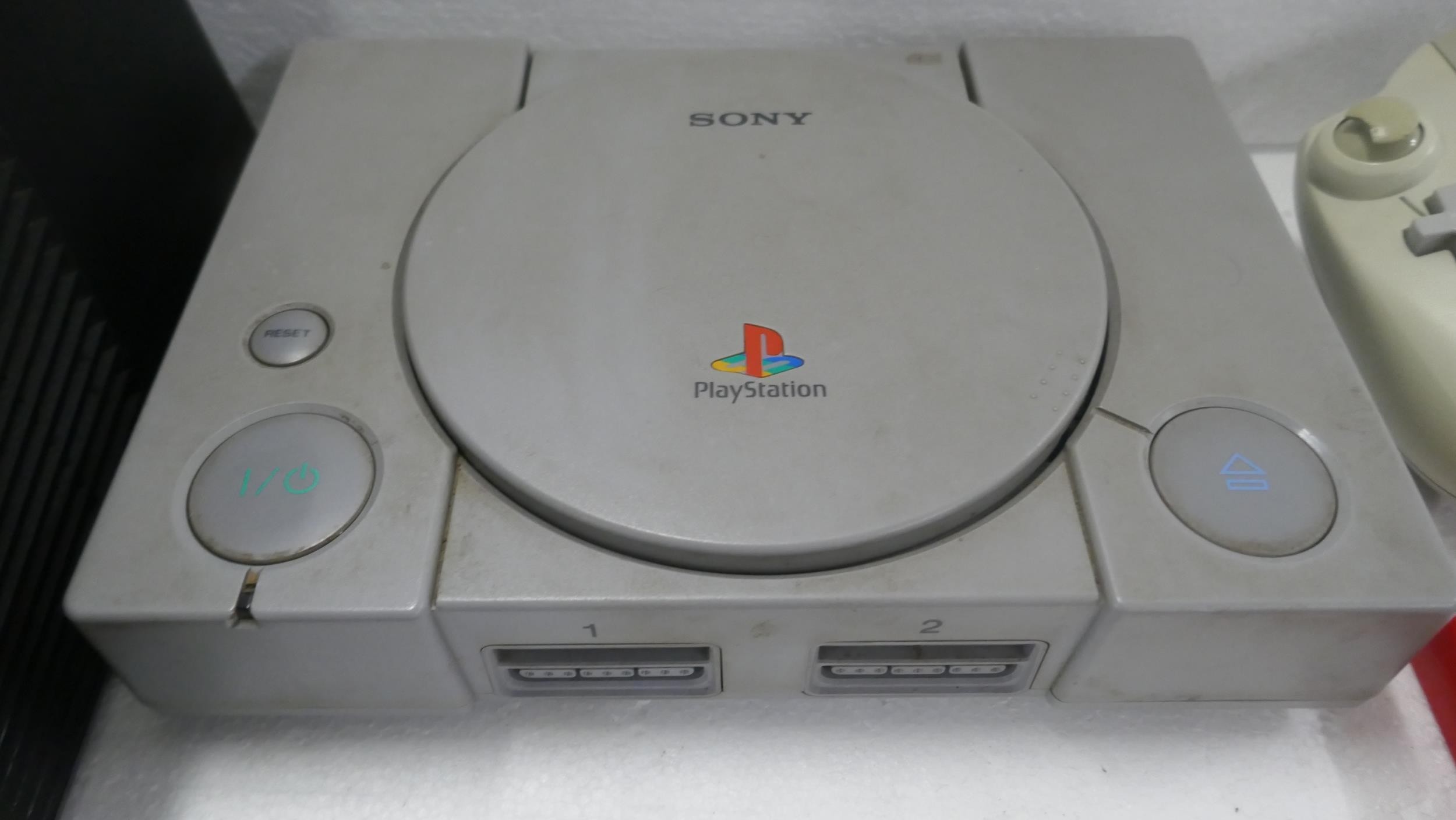 A large quantity of games consoles for spares or repairs including a ...