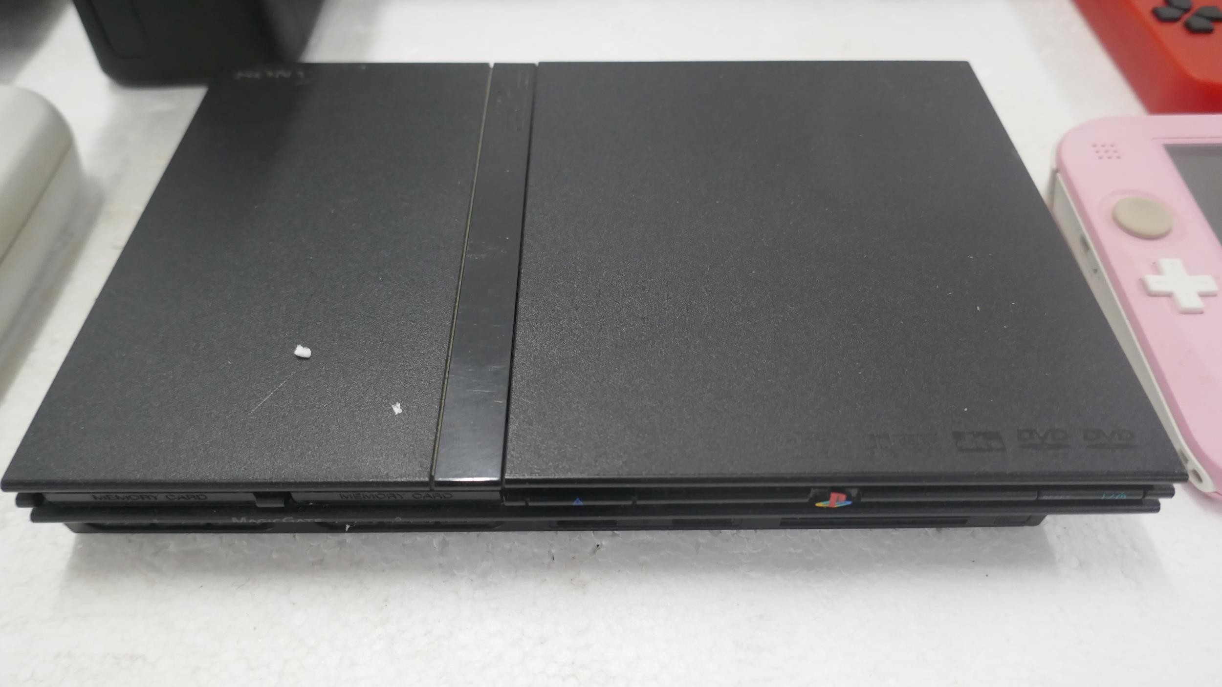 A large quantity of games consoles for spares or repairs including a ...