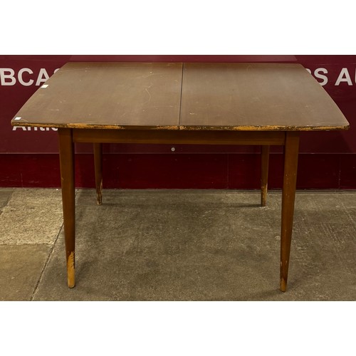 77 - A teak rectangular extending dining table