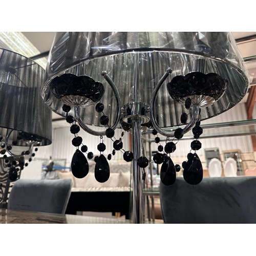 3072 - A pair of black and chrome table lamps
