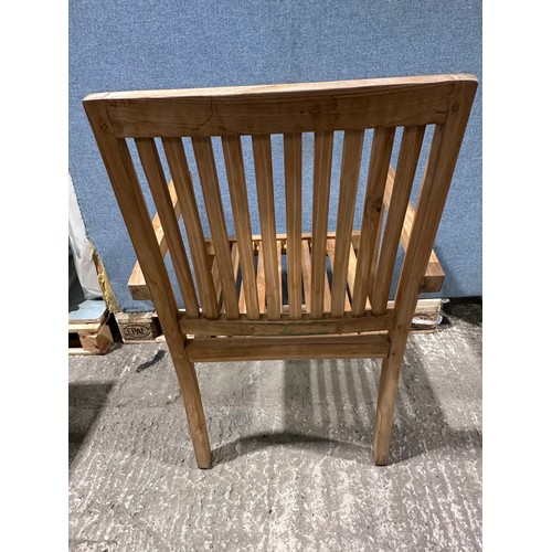 3075 - A teak circular folding garden table and a pair of teak carver chairs